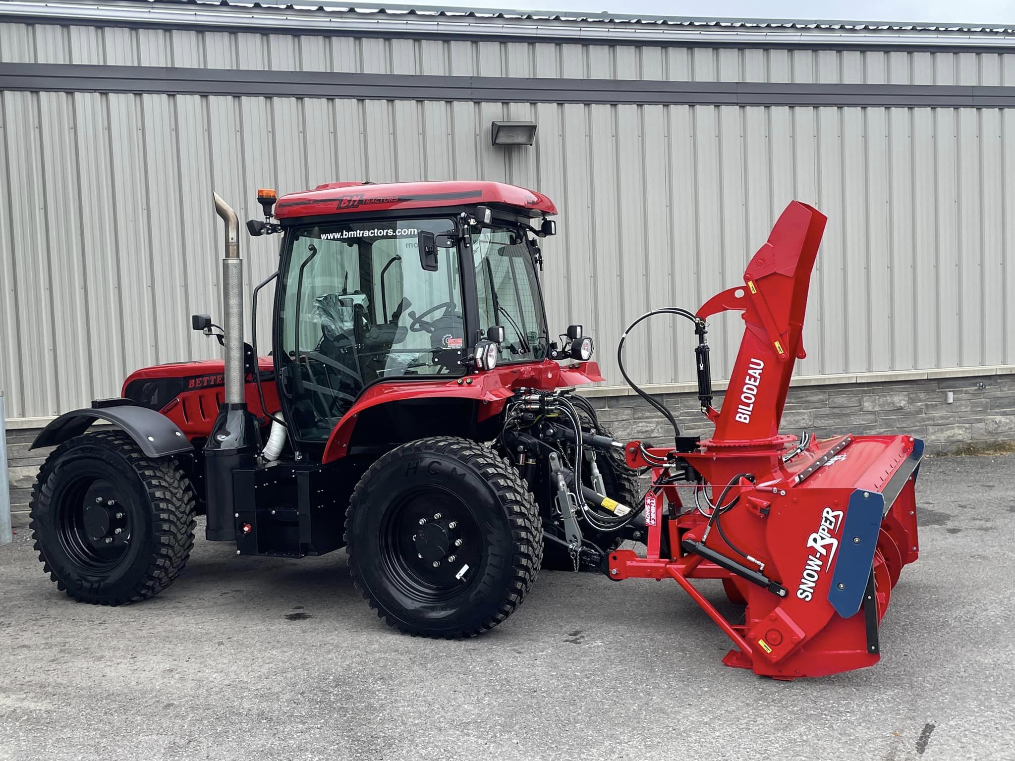 Our commercial tractor-mounted Snow Ripper blower used for residential driveways